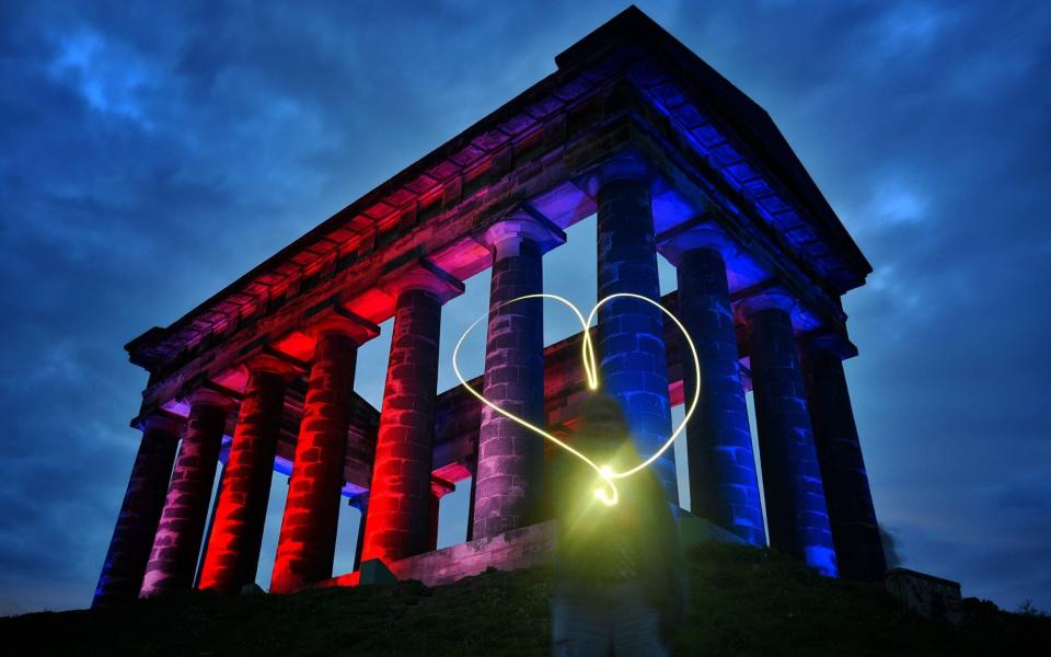 Penshaw Monument has been lit up in red, white and blue tonight (TUES) as a mark of solidarity with the people of Manchester - Credit: Paul Kingston / NNP