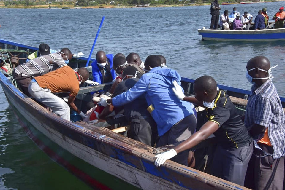 Rescuers retrieve a body from the water near Ukara Island in Lake Victoria, Tanzania Friday, Sept. 21, 2018. The death toll rose above 100 after the passenger ferry MV Nyerere capsized on Lake Victoria, Tanzania state radio reported Friday, while a second day of rescue efforts raced the setting sun. (AP Photo)