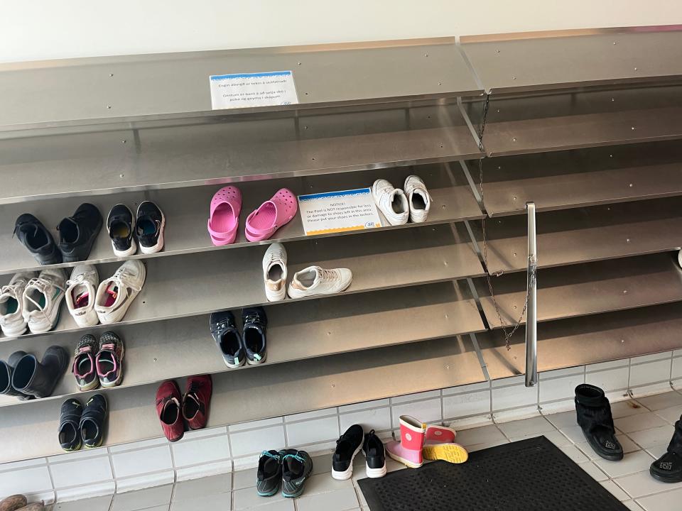 Shelves with shoes on them.