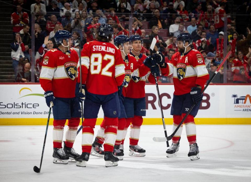 Florida Panthers left wing Matthew Tkachuk (19) celebrates his goal with a fist bump with defenseman Aaron Ekblad (5) during the second period of a hockey game on Thursday, Feb. 8, 2024, at Amerant Bank Arena in Sunrise, Fla.