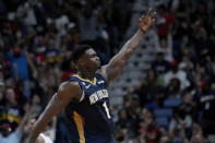 New Orleans Pelicans forward Zion Williamson (1) reacts after making a 3-point basket in the first half of an NBA basketball game against the Phoenix Suns in New Orleans, Sunday, Dec. 11, 2022. (AP Photo/Gerald Herbert)
