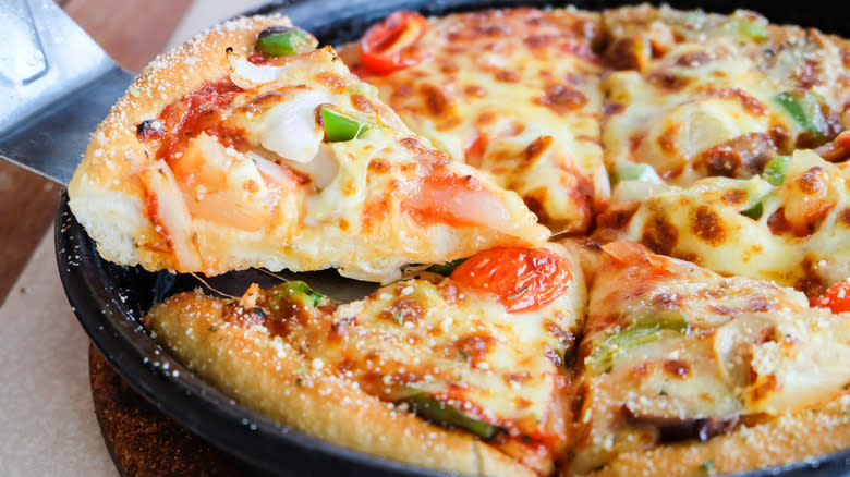 pizza slices on iron skillet