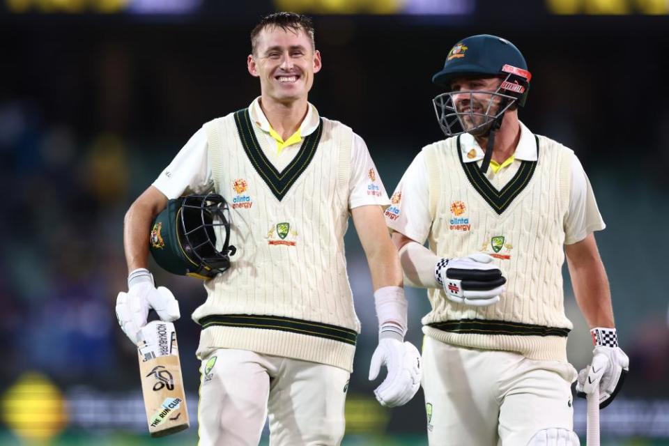 Marnus Labuschagne and Travis Head walk from the field at the end of play.