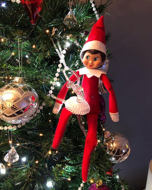 19) Elf on the Shelf as a Christmas tree decoration