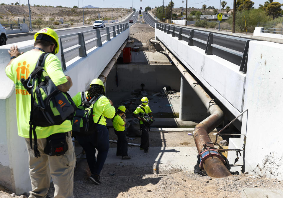 Help of Southern Nevada outreach workers check out homeless encampments in Las Vegas, on Tuesday, July 9, 2024. Help of Southern Nevada travels the streets with flyers about heat, water and vehicles to transport people to cooling centers. (Bizuayehu Tesfaye/Las Vegas Review-Journal via AP)