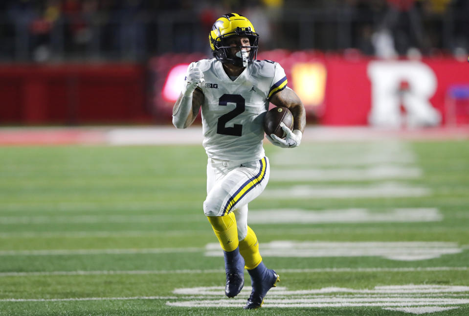 Michigan running back Blake Corum (2) rushes against Rutgers during the first half of an NCAA college football game, Saturday, Nov. 5, 2022 in Piscataway, N.J. (AP Photo/Noah K. Murray)