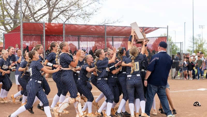 The Enterprise Wolves celebrate after winning the 2A softball state championship against the Beaver Beavers at Spanish Fork Sports Park in Spanish Fork on Saturday, May 11, 2024.
