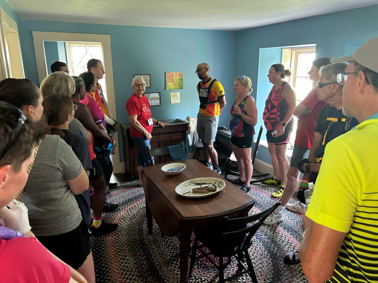 Mary Hoegh (center) leads a tour of the Hitchcock House on Day 2 of RAGBRAI on July 22, 2024.