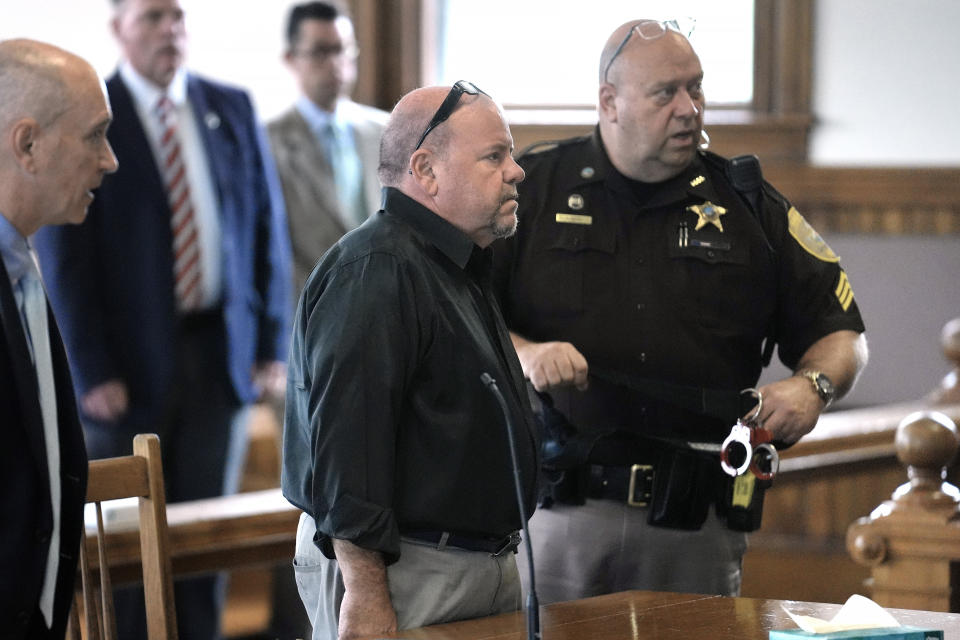 Steve Kramer, center left, is escorted by a court officer as he departs a courtroom, Wednesday, June 5, 2024, at superior court, in Laconia, N.H., following his arraignment in connection with charges of voter suppression and impersonating a candidate. Kramer, a political consultant who sent artificial intelligence-generated robocalls mimicking President Joe Biden's voice to voters ahead of New Hampshire's presidential primary faces more than two dozen criminal charges. (AP Photo/Steven Senne, Pool)