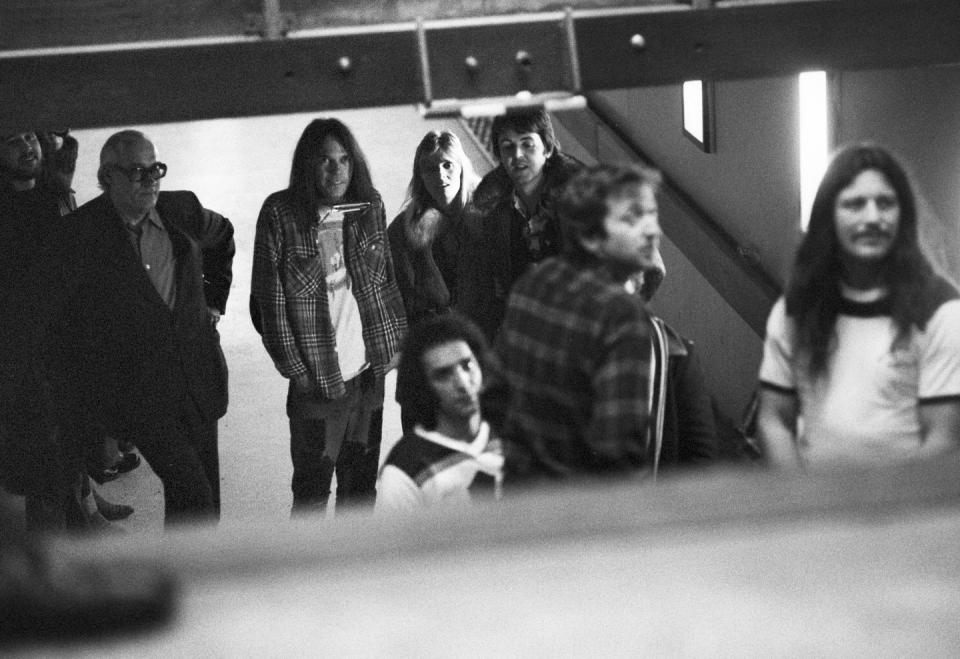 <p>Neil Young (3rd from left) and Frank Sampedro and Ralph Molina of Crazy Horse stand backstage with Paul McCartney and Linda McCartney at the Kuip stadium in Rotterdam, Netherlands in 1976. </p>