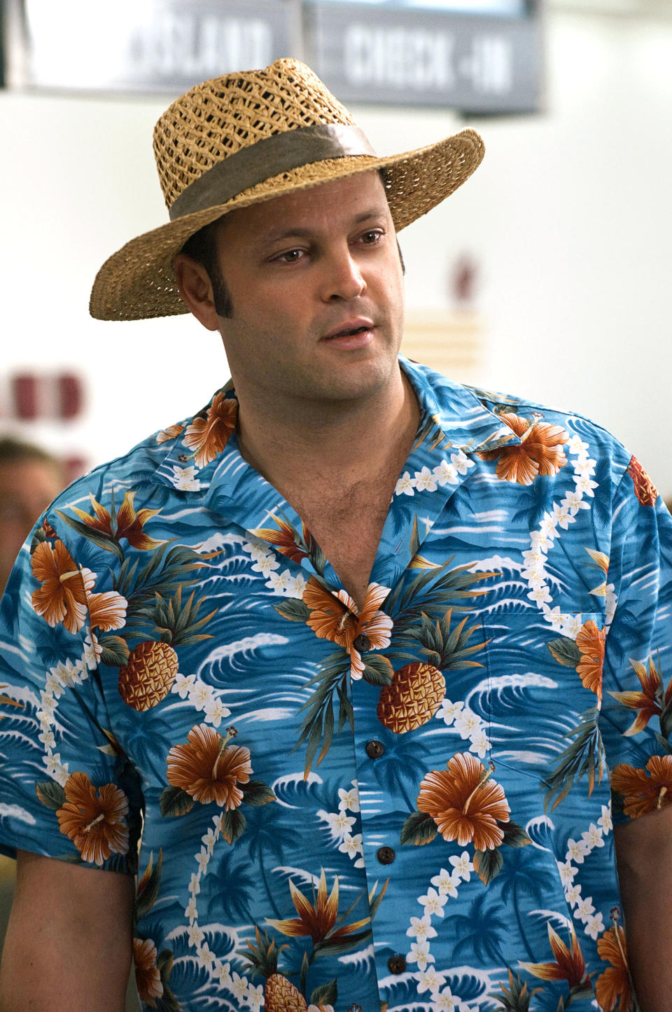 Vince in a straw hat and Hawaiian shirt