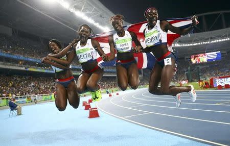 2016 Rio Olympics - Athletics - Final - Women's 4 x 100m Relay Final - Olympic Stadium - Rio de Janeiro, Brazil - 19/08/2016. Team Britain (GBR) pose for pictures after winning bronze. REUTERS/Kai Pfaffenbach