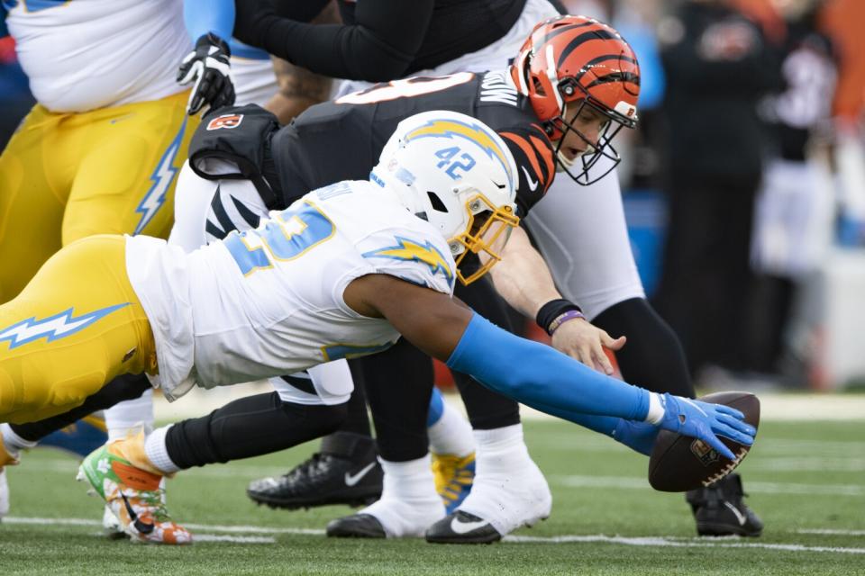 Chargers outside linebacker Uchenna Nwosu forces a fumble on Cincinnati Bengals quarterback Joe Burrow.