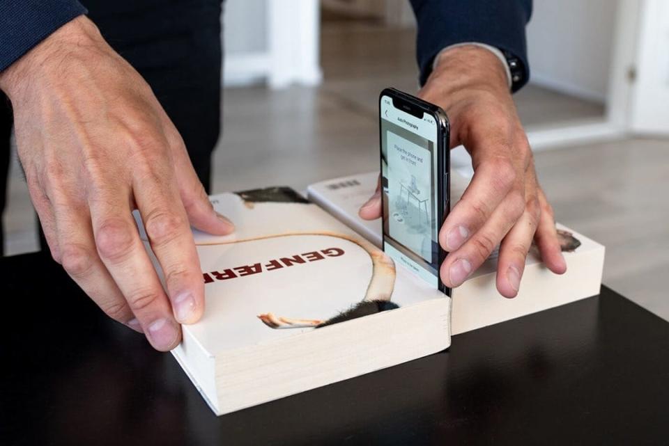 Placing your phone between two books, which can act as a stand.