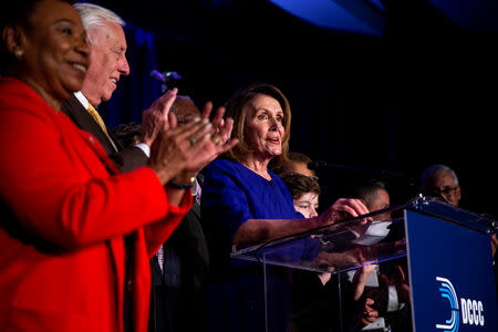 U.S. House Minority Leader Nancy Pelosi reacts alongside fellow House Democrats to the results of the U.S. midterm elections at a Democratic election night rally in Washington, U.S. November 6, 2018. REUTERS/Al Drago