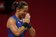 CORRECTS TO HIDILYN DIAZ OF PHILIPPINES FROM ANA GABRIELA LOPEZ FERRER OF MEXICO - Hidilyn Diaz of Philippines celebrates after a lift as she competes in the women's 55kg weightlifting event, at the 2020 Summer Olympics, Monday, July 26, 2021, in Tokyo, Japan. (AP Photo/Luca Bruno)