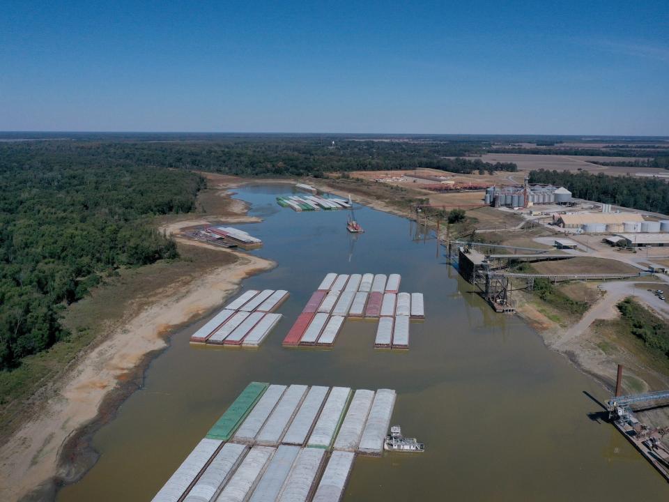 barges sit in low mississippi waters aerial view