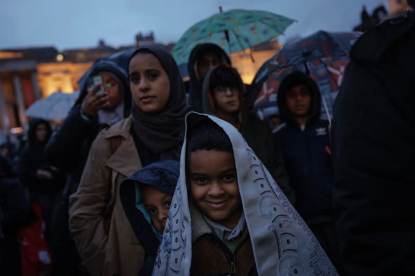 People gather ahead of an open Iftar event in Trafalgar Square on April 08, 2024 in London, England. Open Iftar is organised by the award-winning charity Ramadan Tent Project, which has brought over a million people across the UK for an evening meal at the country's best-loved cultural venues. Other venues during Ramadan Festival 2024 have included the Etihad Stadium in Manchester, V&A Dundee, and Windsor Castle