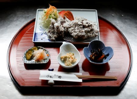 A set menu of deep-fried whale nuggets are prepared at the restaurant P-man in Minamiboso