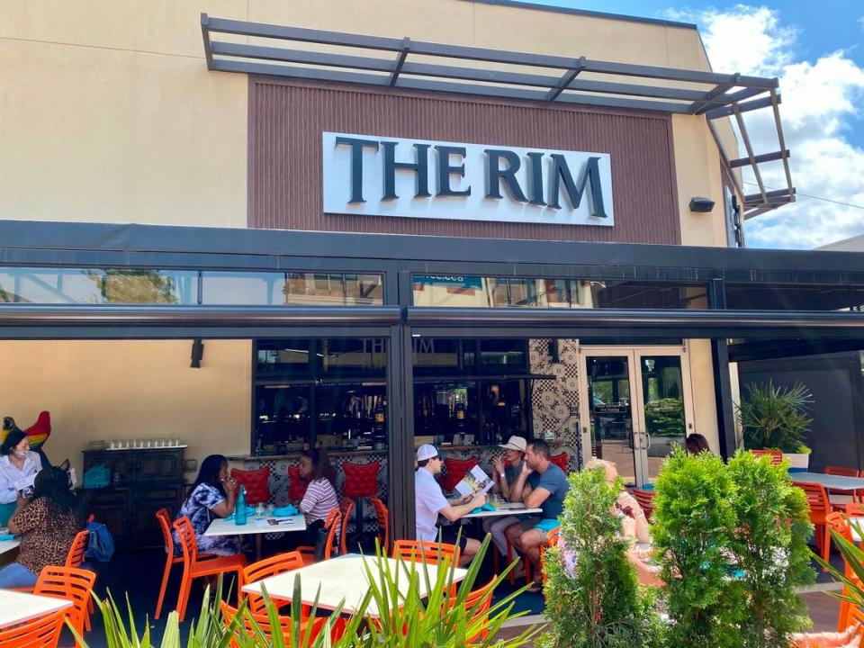 The patio at the Rim faces the Grove at Waterside, the shopping center courtyard.