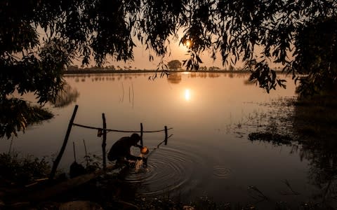 Sun rises over the Ayeyarwady region where many farmers have had their land confiscated - Credit: Patrick Brown/Human Rights Watch