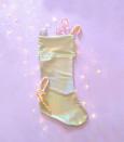 This photo shows a holographic holiday stocking sold by the shop fashionmeme on Etsy.com. From tablescapes to apparel, the gift possibilities in white are endless for the holidays. (AP Photo/fashionmem.etsy.com)