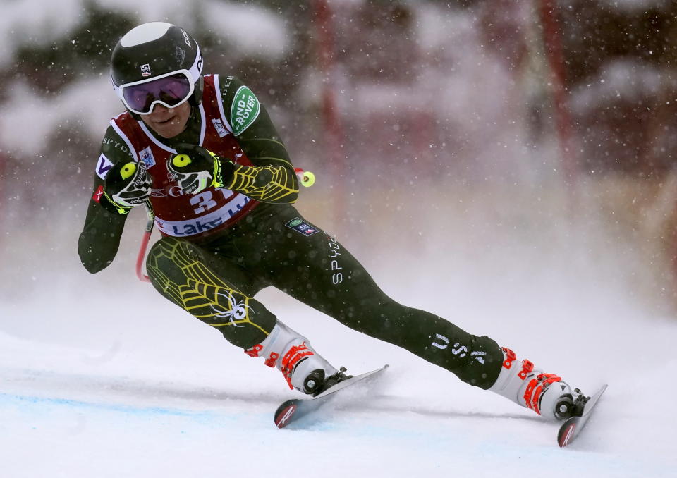 FILE - In this Dec. 6, 2019, file photo, Alice Merryweather, of the United States, skis down the course during the women's World Cup downhill ski race in Lake Louise, Alberta. Merryweather gives Tarot card readings. Outside passions are a way for racers to take their minds off always thinking about racing. (Frank Gunn/The Canadian Press via AP, File)