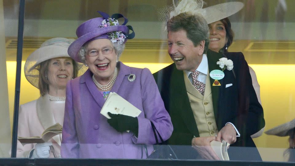 Queen Elizabeth II and John Warren cheer on her horse Estimate to win the Gold Cup at Royal Ascot on June 20, 2013. - Mark Cuthbert/UK Press/Getty Images