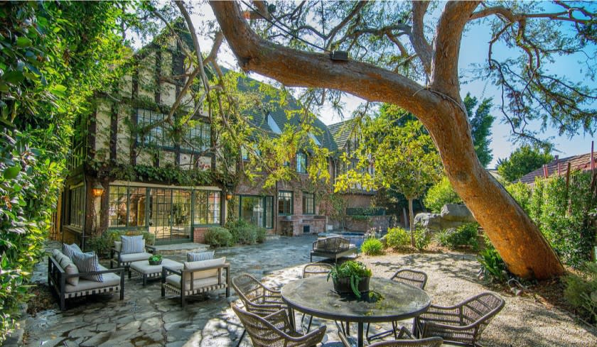 Built in 1927, the three-story home still boasts original details such as arches, moldings and stained glass windows.