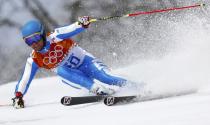 Italy's Davide Simoncelli skis during the first run of the men's alpine skiing giant slalom event at the 2014 Sochi Winter Olympics at the Rosa Khutor Alpine Center February 19, 2014. REUTERS/Dominic Ebenbichler (RUSSIA - Tags: SPORT SKIING OLYMPICS)