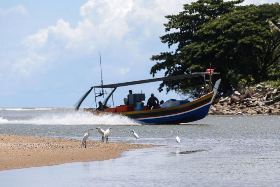 Fishermen return with their catch of the day at the Whispering Fish Market in Penang August 3, 2021. ― Picture by Sayuti Zainudin