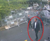 ADDS NAME OF SUSPECT - In a frame from surveillance camera footage taken Oct. 2, 2018, and published Thursday, Oct. 18, 2018, by the pro-government Turkish newspaper Sabah, a man identified by Turkish officials as Maher Abdulaziz Mutreb, walks toward the Saudi Consulate in Istanbul before writer Jamal Khashoggi disappeared. Saudi Arabia, which initially called the allegations "baseless," has not responded to repeated requests for comment from The Associated Press over recent days, including on Thursday over Mutreb’s identification. (Sabah via AP)