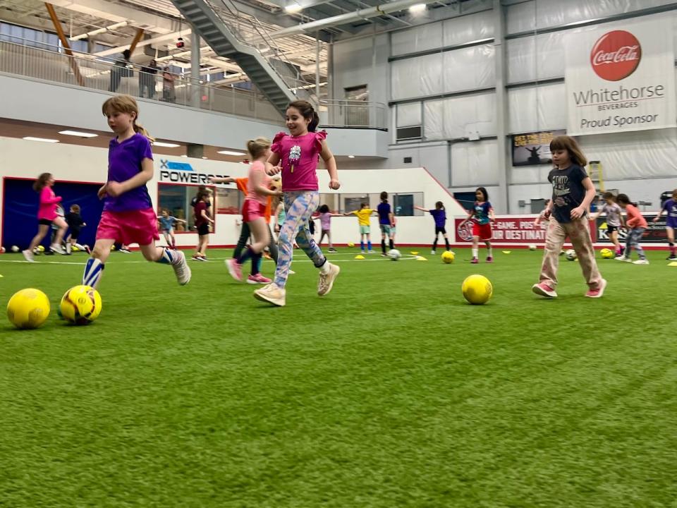 Players dribble the ball in a free girls soccer session this week. Coach Johanna Smith says the program is designed to put soccer in a "safe and accessible format". The sessions are free, indoor, for all levels of experience, and require no long-term commitment.  