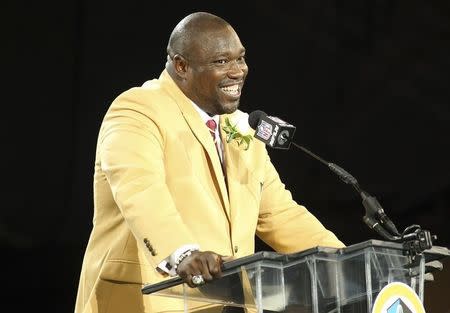 New inductee Warren Sapp talks during his acceptance into the NFL Pro Football Hall of Fame in Canton, Ohio August 3, 2013. REUTERS/Aaron Josefczyk