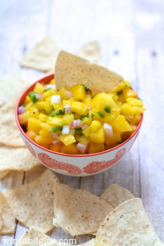 <p>Wine and Glue</p><p>Change things up with this delicious pineapple mango salsa. Try the great combination of sweet and savory with a little kick. <a href="http://www.wineandglue.com/2014/07/pineapple-mango-salsa.html" rel="nofollow noopener" target="_blank" data-ylk="slk:Get the recipe HERE;elm:context_link;itc:0;sec:content-canvas" class="link rapid-noclick-resp">Get the recipe HERE</a>. </p>