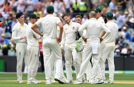 Australia's captain Tim Paine reacts after a review by India to reverse the dismissal of Cheteshwar Pujara was upheld during day three of the first test match between Australia and India at the Adelaide Oval in Adelaide, Australia, December 8, 2018. AAP/Dave Hunt/via REUTERS