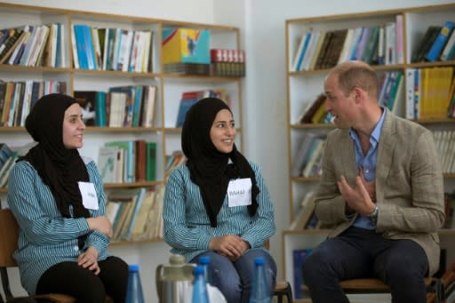 Britain's Prince William (R) speaks with Palestinian students at a school operated by the UNRWA inside Al-Jalazoun refugee camp near the West Bank city of Ramallah on June 27, 2018