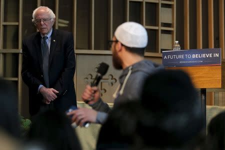 U.S. Democratic presidential candidate and U.S. Senator Bernie Sanders listens as Abdelmajid Jondy speaks during a community forum about contaminated water in Flint, Michigan February 25, 2016. REUTERS/Brian Snyder