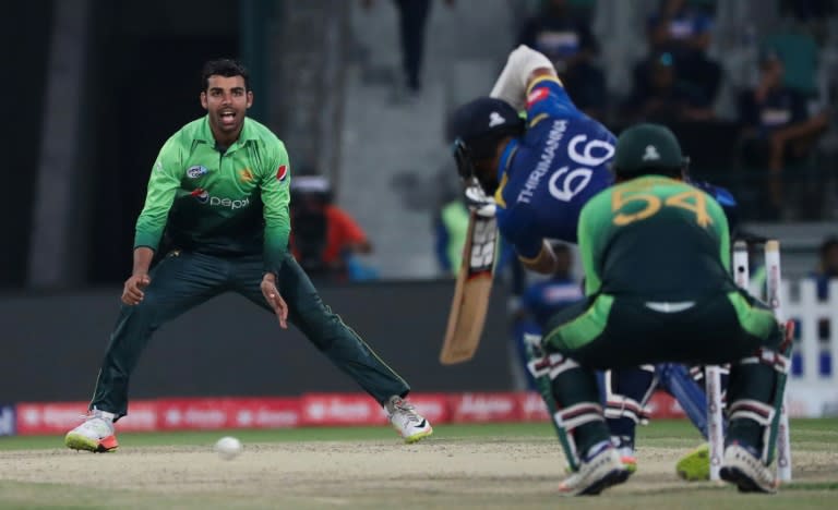 Shadab Khan (L) of Pakistan bowls during their third one day international match against Sri Lanka in Abu Dhabi at Zayed Cricket Stadium on October 18, 2017