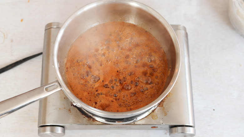 hot honey cooking in pan