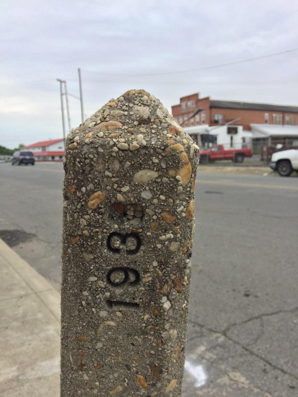 This mysterious marker stands yet today in front of 418 S. Broad Street. When or why it was placed there is unknown. It has lost one number and a small sign that was once attached.