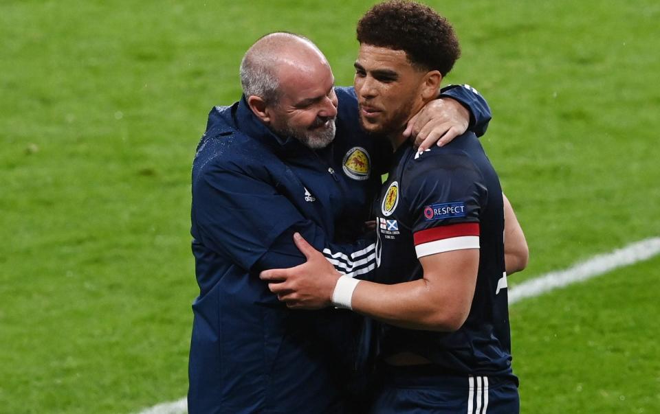 Steve Clarke embraces Che Adams at the final whistle - REUTERS