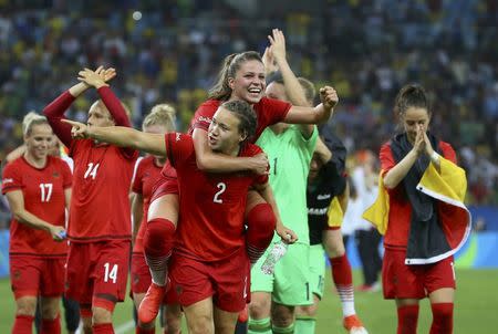 2016 Rio Olympics - Soccer - Final - Women's Football Tournament Gold Medal Match - Sweden v Germany - Maracana - Rio de Janeiro, Brazil - 19/08/2016. Josephine Henning (GER) of Germany and Melanie Leupolz (GER) of Germany celebrate winning the gold. REUTERS/Murad Sezer