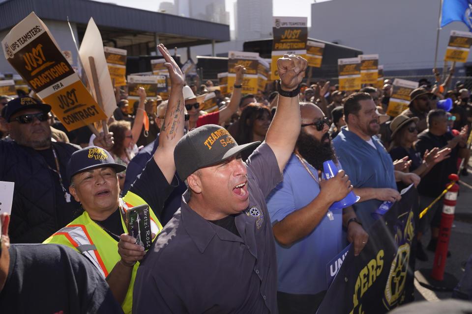 FILE - UPS teamsters and workers hold a rally in downtown Los Angeles, Wednesday, July 19, 2023, as a national strike deadline nears. The Teamsters said Wednesday that they will resume contract negotiations with UPS next week, marking an end to a stalemate that began two weeks ago when both sides walked away from talks while blaming each other. (AP Photo/Damian Dovarganes, File)