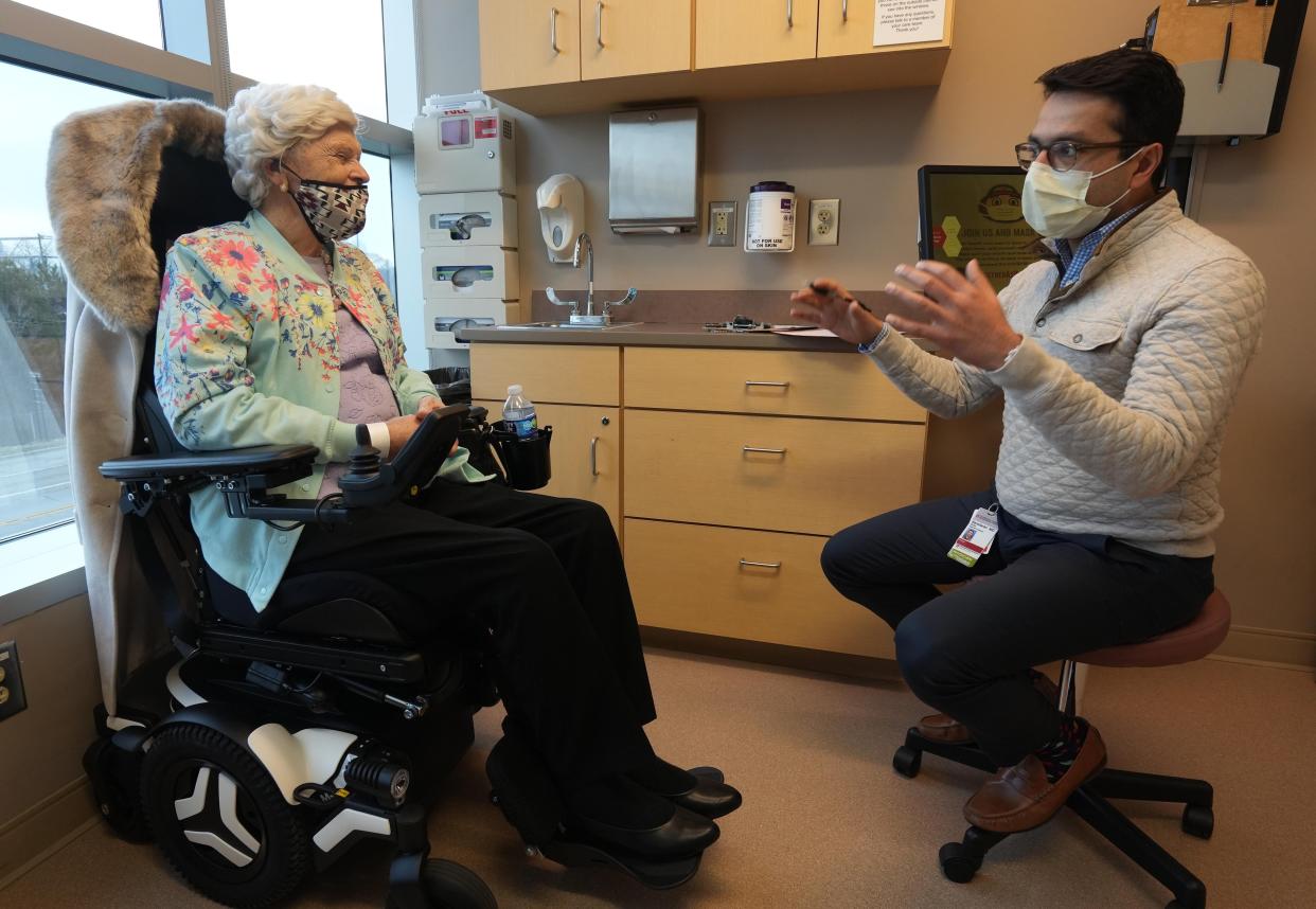 Hoping to get gender-confirming surgery, Renee Mongeau, 79, talks with Dr. Nima Baradaran at the Wexner Medical Center.