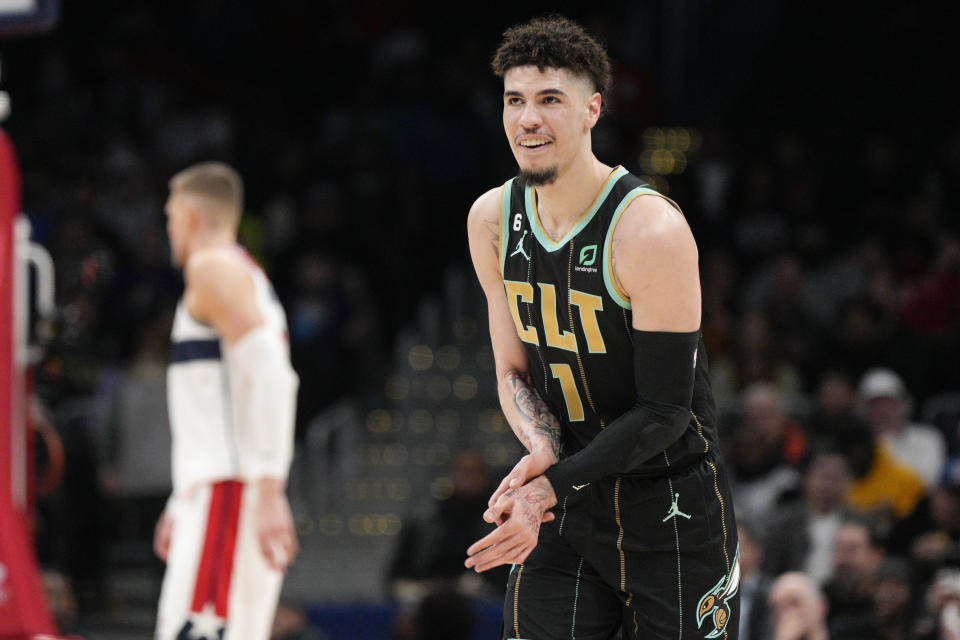 Charlotte Hornets guard LaMelo Ball (1) reacts during the first half of the team's NBA basketball game against the Washington Wizards, Wednesday, Feb. 8, 2023, in Washington. (AP Photo/Jess Rapfogel)