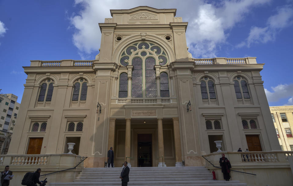 People stand outside Eliyahu Hanavi synagogue in Alexandria, Egypt, Friday, Jan. 10, 2020, re-opened three years after the Egyptian government started the renovations of the synagogue originally built in 1354. (AP Photo/Hamada Elrasam)