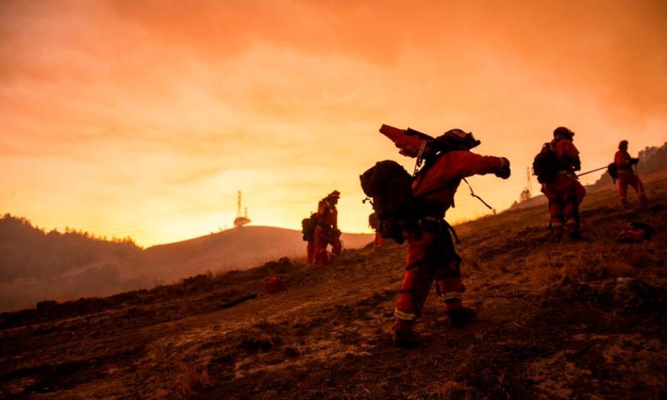 A crew of inmate firefighters make their way to firefighting operations to battle the Kincade Fire in Healdsburg, California, last year.