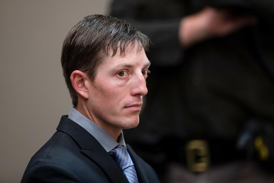 Ex-Grand Rapids Police Officer Christopher Schurr appears for a court hearing at the Kent County Courthouse in Grand Rapids on Oct. 26, 2022.