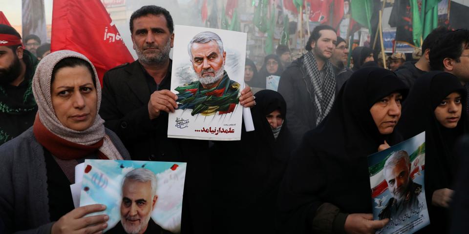 Mourners holding posters of Iranian Gen. Qassem Soleimani attend a funeral ceremony for him and his comrades, who were killed in Iraq in a U.S. drone strike on Friday, at the Enqelab-e-Eslami (Islamic Revolution) Square in Tehran, Iran, Monday, Jan. 6, 2020.